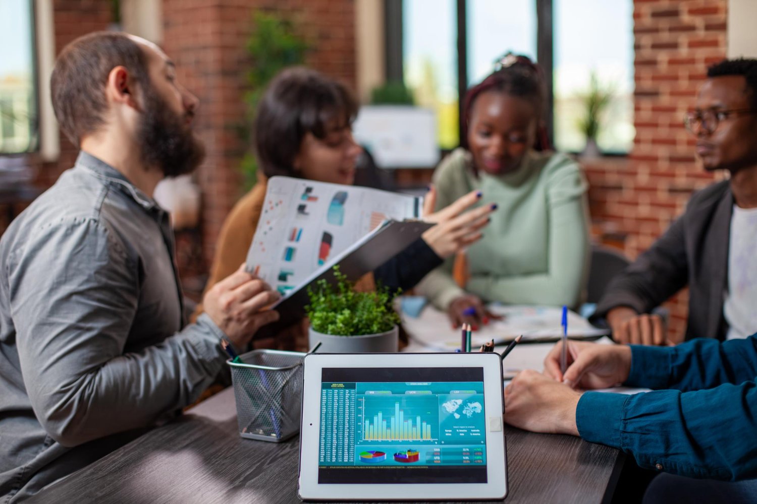 Digital marketing team reviewing analytics charts to highlight what makes SEO company different