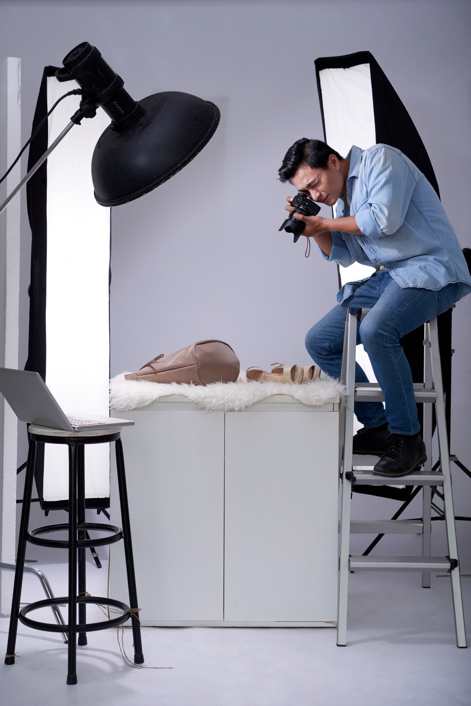 ecommerce product photography services with photographer shooting fashion products in studio