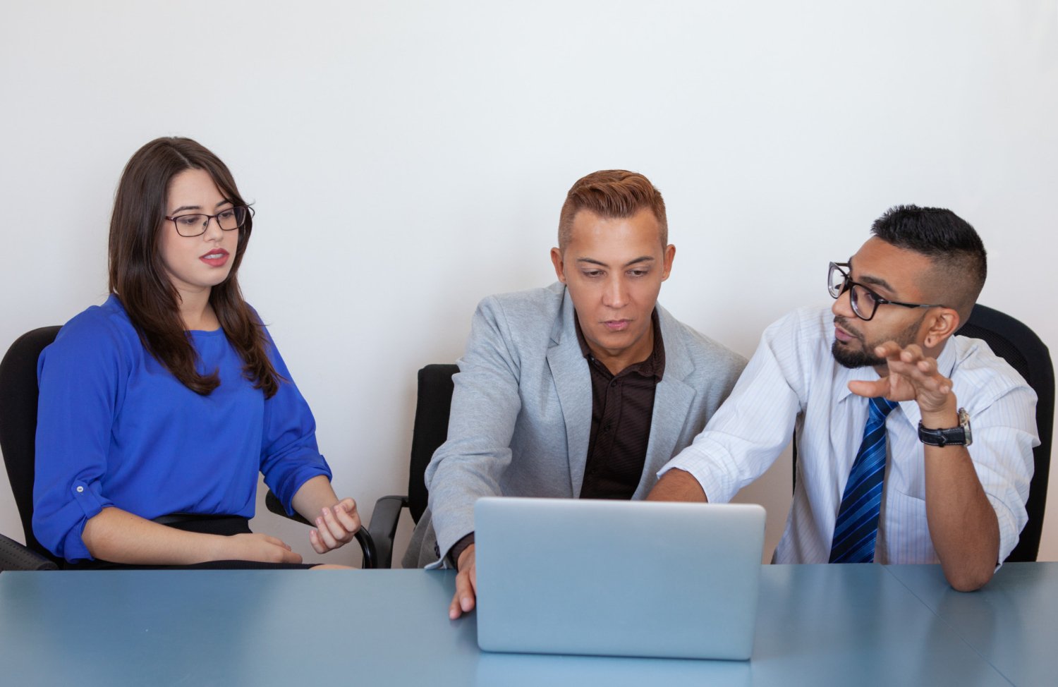 Serious sales manager giving office app presentation at modern workspace