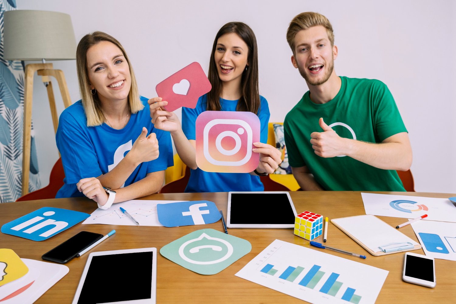 social media marketing team holding Snapchat icon for Instagram marketing and advertising services