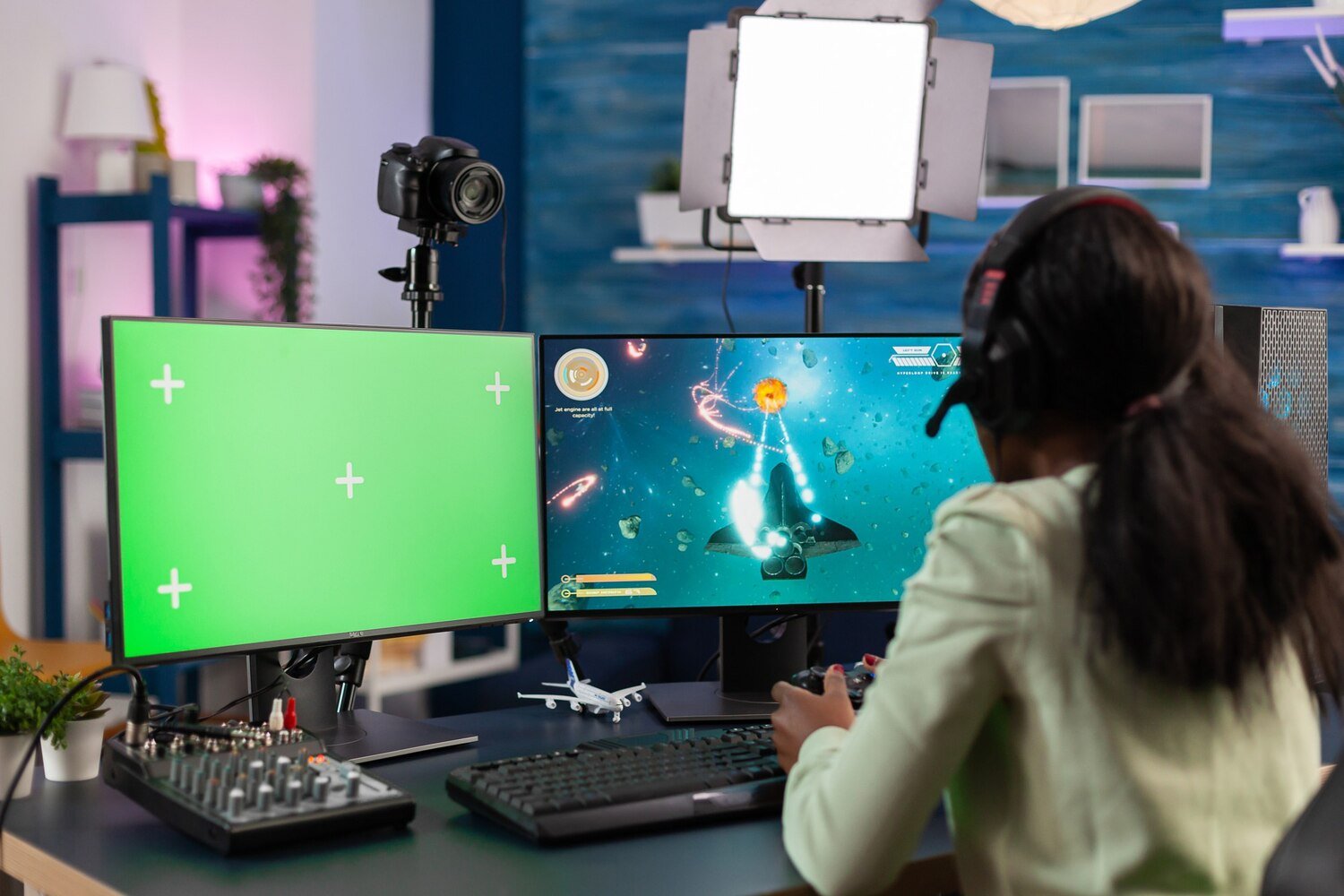 Professional gamer streaming on PC with green screen setup representing video animation services in Lahore, 2D and 3D animation, video production, motion graphics, and digital content creation